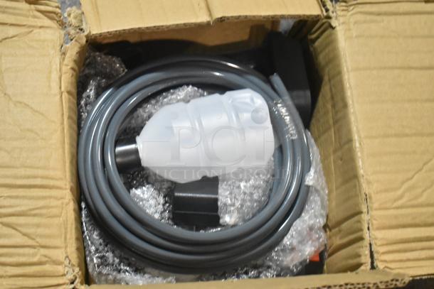 Brand new scratch and dent hose kit in open cardboard box, coiled with protective packaging, slight outer box wear visible.