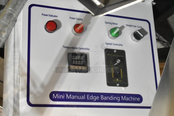 Brand new mini manual edge banding machine with scratch and dent, featuring power controls, temperature and speed controllers.
