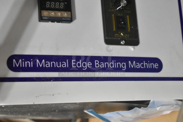 Brand new scratch and dent Mini Manual Edge Banding Machine, control panel visible, with "Mini Manual Edge Banding Machine" label.