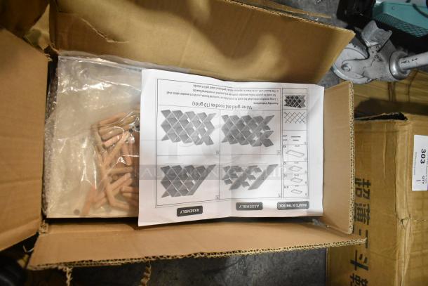 BRAND NEW 200-HG-ZT527-439 wine rack in box, scratch and dent, with assembly instructions and wooden pegs visible.