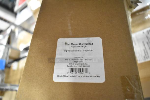 Cardboard box with label reading "Dual Mount Curved Rod, Adjustable Length, 50-72 in," distributed by Target, origin China.