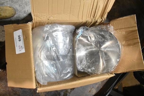 Boxed items include a juice dispenser and white cart, brand new with minor box damage. Auction label indicates lot 309, quantity x2.