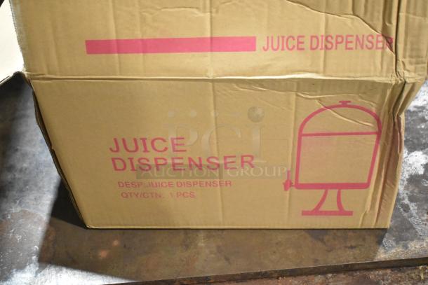 Cardboard box labeled "Juice Dispenser," indicating one piece. Box appears slightly dented, featuring a dispenser silhouette.