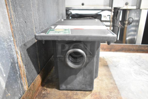 Brand new Ashland PolyTrap 4804 grease trap, 8 lb capacity, with threaded connections. Slight scratch and dent condition.
