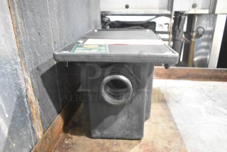 Brand new Ashland PolyTrap 4804 grease trap, 8 lb capacity, with threaded connections. Slight scratch and dent condition.