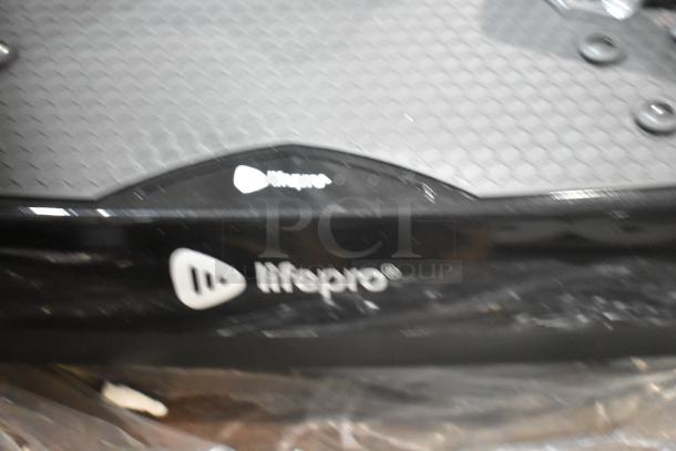 BRAND NEW LifePro Vibration Plate with minor scratches, 120 Volts, 1 Phase. Logo visible on black surface.