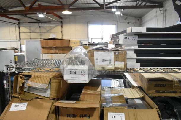 Auction items on shelves, labeled "314 QTY X2," mixed condition, includes boxes. Items are new with some damage.