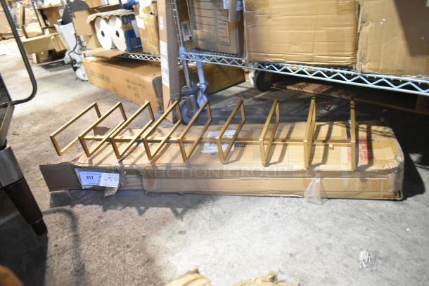 Two new scratch and dent metal shelving units, item 34229952, packaged in cardboard boxes, slight box wear visible.