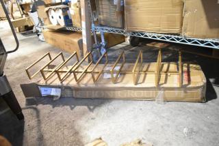 Two new scratch and dent metal shelving units, item 34229952, packaged in cardboard boxes, slight box wear visible.