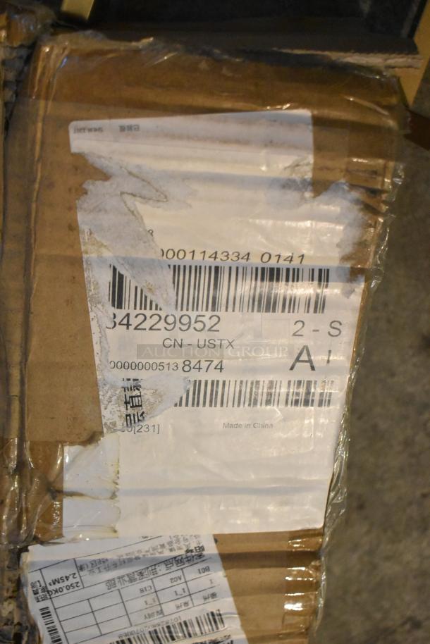 Cardboard box with barcode label showing "34229952" and "Made in China." Box condition is scratched and dented.