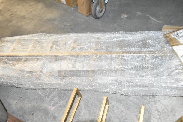 Two brand new scratch and dent items wrapped in bubble wrap, labeled 34229952. Includes two bid multipliers.