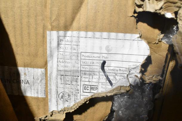 Box of plates, brand new, with scratch and dent damage. Label shows SKU ER17524. Made in China. Packaging is torn.