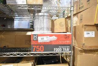 Brand new Member's Mark food trays box on shelf, marked as quantity 750, alongside a clear cylindrical jar on top.
