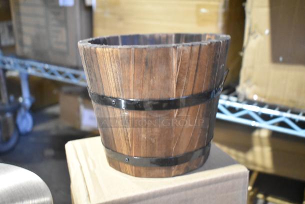 Wooden barrel decoration, brand new with slight scratches. Features metal bands and natural wood finish.