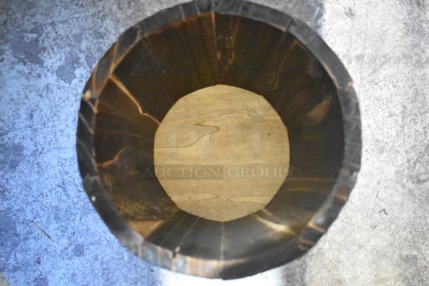 Wooden barrel decoration, new with scratch and dent. Circular interior, dark wood finish. Part of a four-item auction set.