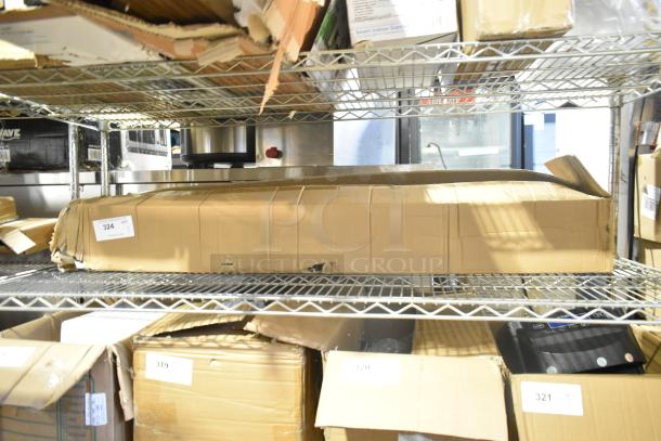 Brand new unit in original packaging with visible scratches and dents, item number 324 on shelf.