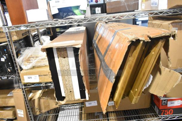 Two brand new "scratch and dent" Room Essentials 5-shelf bookcases in original but damaged packaging, stored on a metal shelf.