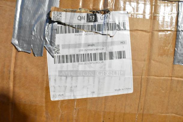 Cardboard box with torn shipping label and visible barcodes, indicating an item inside marked "Made in China."
