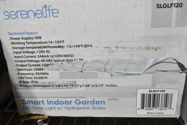 Box for SereneLife SLGLF120 Smart Indoor Garden with detailed specs. New, slight box damage. Includes LED grow light, hydroponic boxes.