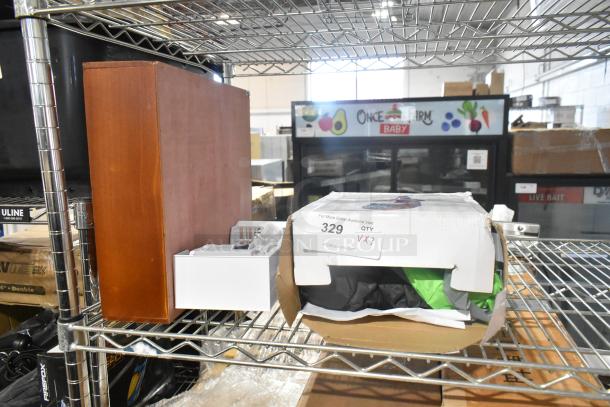 Three brand new items including an inflatable witch decoration and a wooden unit on a metal shelf, with minor box damage.