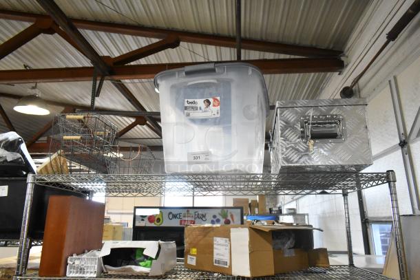 Six items including a diamond plate tool box, clear poly bin labeled "bella," and wire baskets on metal shelves.