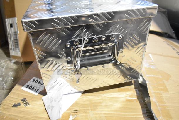 Diamond plate tool box with metallic finish, key lock, and handle. Part of a lot with poly bin and baskets.