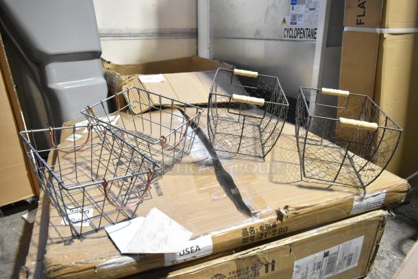 Six metal wire baskets with wooden handles on a cardboard box. Includes diamond plate tool box and poly bin.