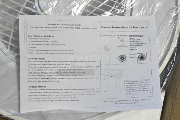 New scratch and dent ceiling fan lamp with instructions, shown partially unboxed. Ideal for installation projects.