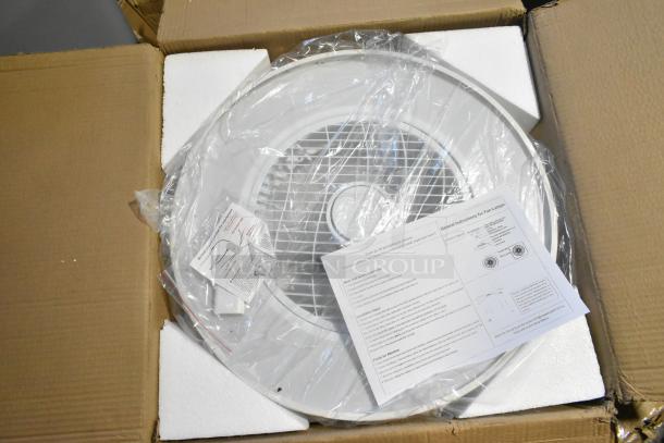 New fan lamp in packaging, with instructions visible. Scratch and dent condition, includes foam padding for protection.