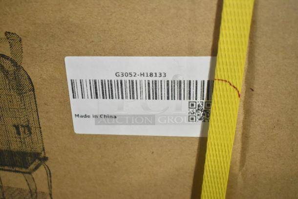 Brand new G3052-H18133 bird cage in box. Scratch and dent condition. Label shows barcode and "Made in China." Yellow strap visible.