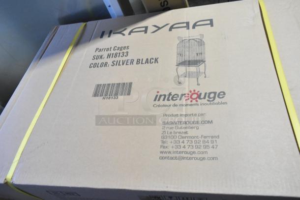 Box labeled "IKAYAA Parrot Cages," SKU: H18133, color: silver black. Includes contact details for Interouge.