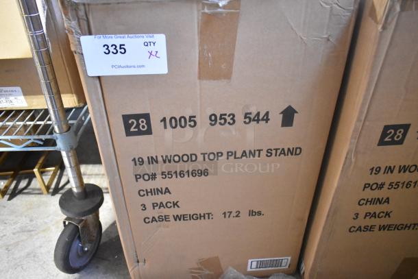 Cardboard box of 19" wood top plant stand, labeled as "scratch and dent," 3-pack, weight 17.2 lbs, PO# 55161696.