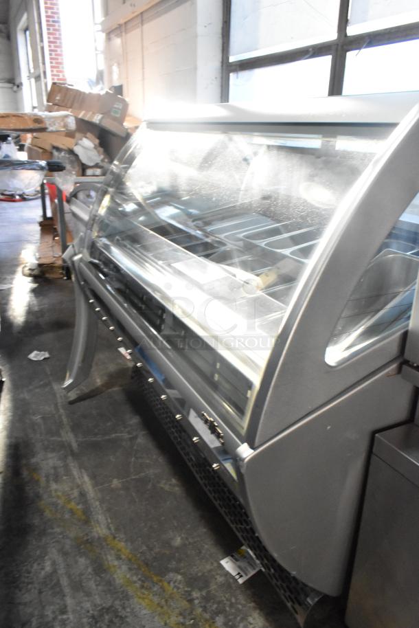 Sevel metal gelato case merchandiser with stainless steel drop-in bins, glass display, in good condition.