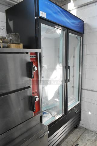 BRAND NEW SCRATCH AND DENT! 2025 Avantco 178GDC40HCB Metal Commercial 2 Door Reach In Cooler Merchandiser w/ Poly Coated Racks on Commercial Casters. See Pictures for Broken Glass. 115 Volts, 1 Phase. Tested and Working! - Item #1217416