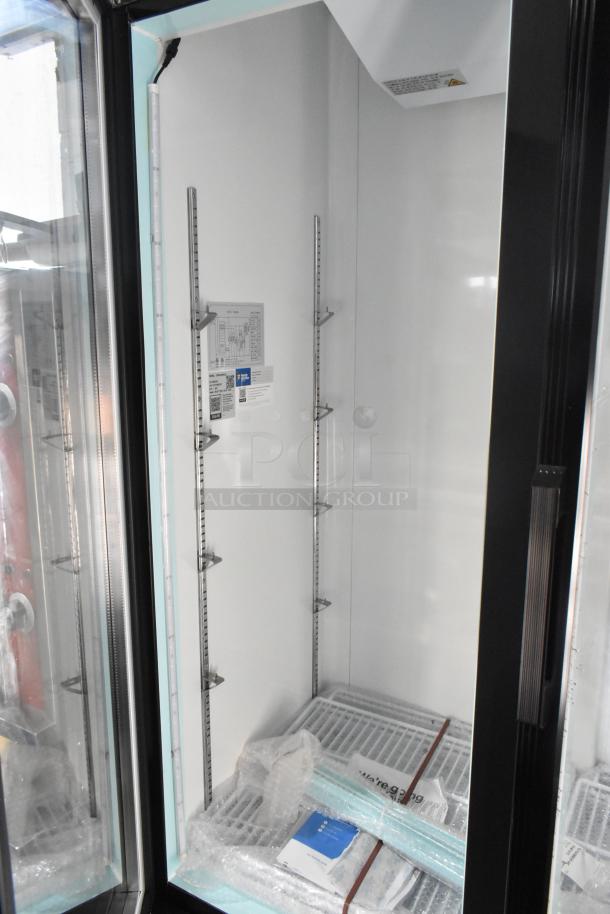 Brand new Avantco 178GDC40HCB commercial cooler, 2 doors, metal, poly-coated racks, commercial casters, broken glass visible.
