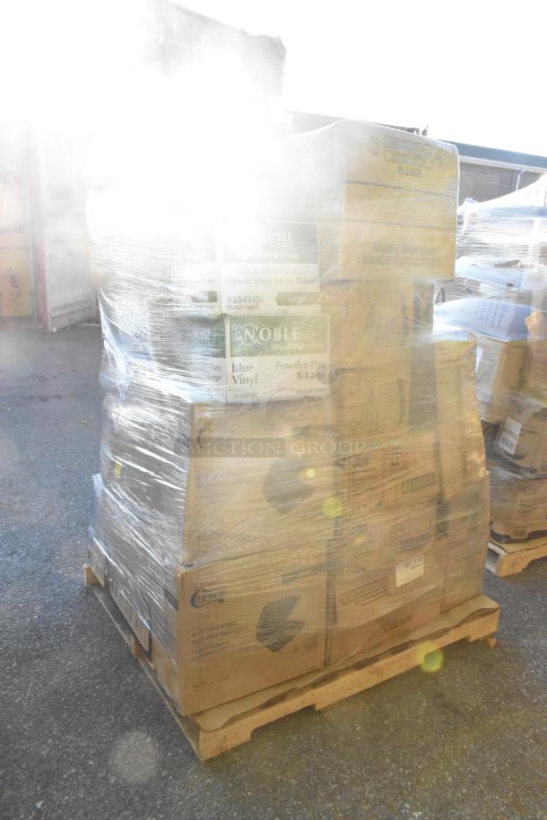 Large pallet of assorted brand new items including cold cups, paper towels, take-out containers, and lids, wrapped in plastic.