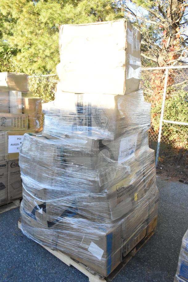 Pallet of 25 scratch and dent items including cold cups, paper towels, take-out containers, and lids, wrapped in plastic film.