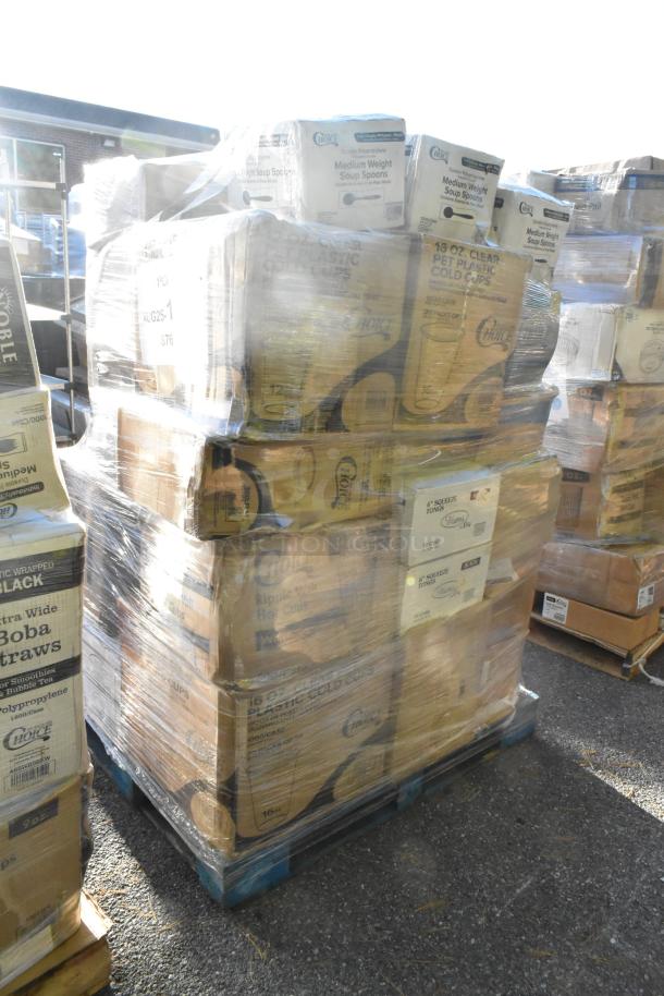 Pallet of scratch and dent items including towels, gloves, containers, cups; labeled boxes wrapped in plastic.