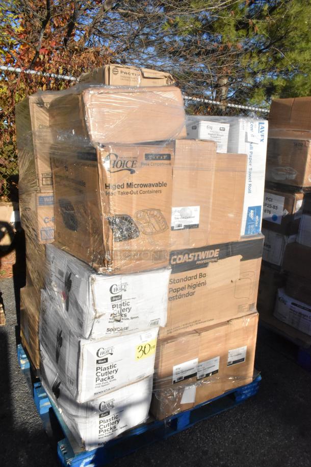 Pallet of boxed scratch and dent items including containers, bags, towels, and cutlery. New, labeled for easy transport.