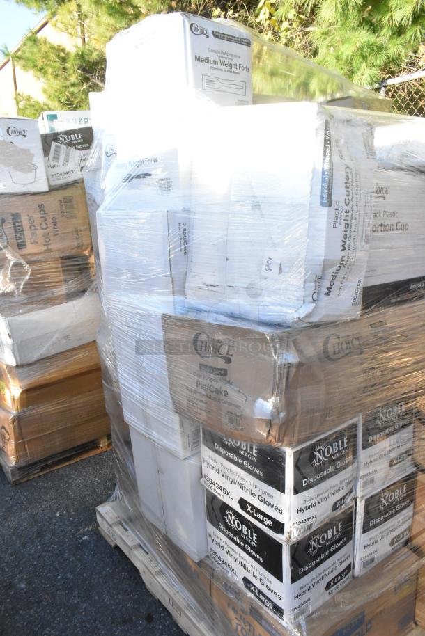Pallet of scratch and dent items including Noble gloves, Choice cups, and paper towels. Items are shrink-wrapped and brand new.