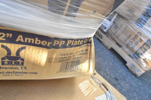 29 new scratch and dent items including GET CO-101-A amber plate covers, 12 per case. Box label shows item details.