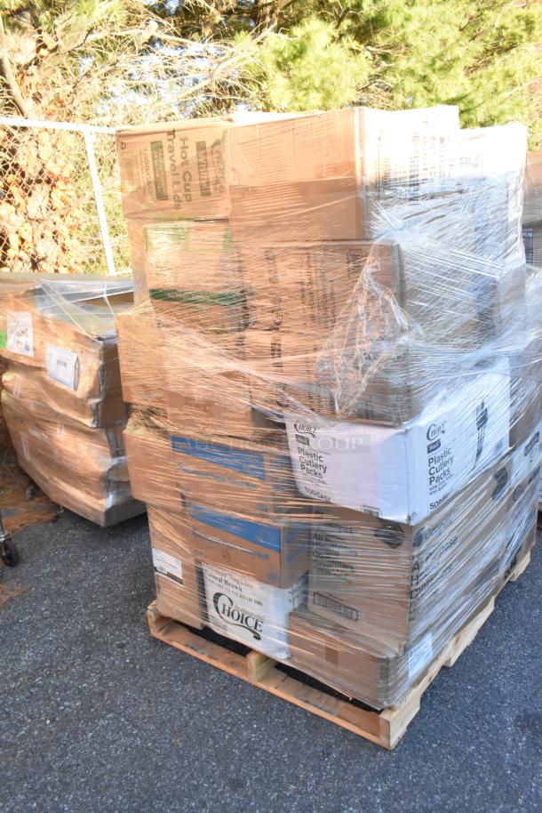 Pallet of brand new scratch and dent items, including cup carriers, cake circles, salad bowls, and plastic plates, shrink-wrapped.