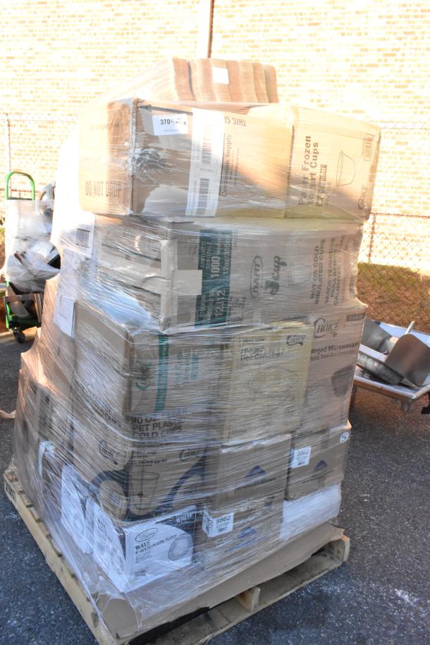 Pallet with boxes of scratch and dent items, including cup sleeves, plastic plates, bowls, and trays, wrapped in plastic.