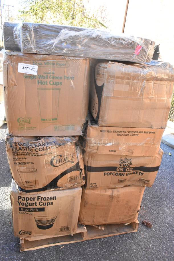 Pallet of 23 scratch and dent boxes containing cold cups, popcorn buckets, mop heads, and paper towels. Boxes show brand markings.