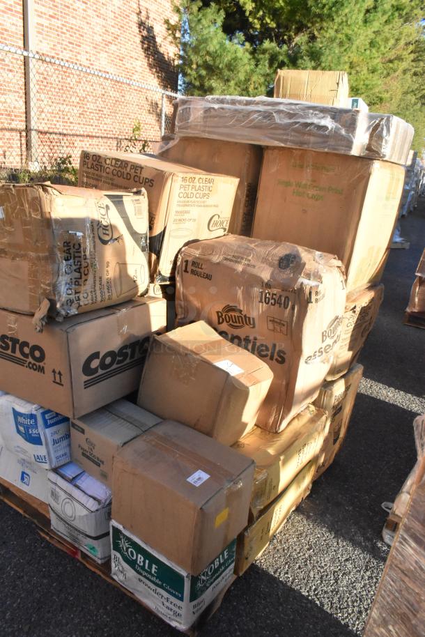 Pallet of 23 mixed items, including Bounty towels, Costco cups, popcorn buckets. Some boxes dented. New condition overall.
