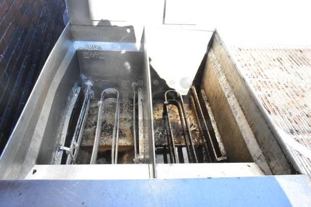 Giles EOF-24 stainless steel 3-bay electric deep fat fryer with dumping station and commercial casters, 480V, 3-phase.