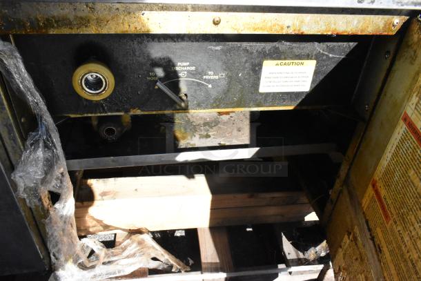 Giles EOF-24 stainless steel 3-bay deep fat fryer, electric, with dumping station. Signs of use; 480V, 3-phase. Caution label visible.