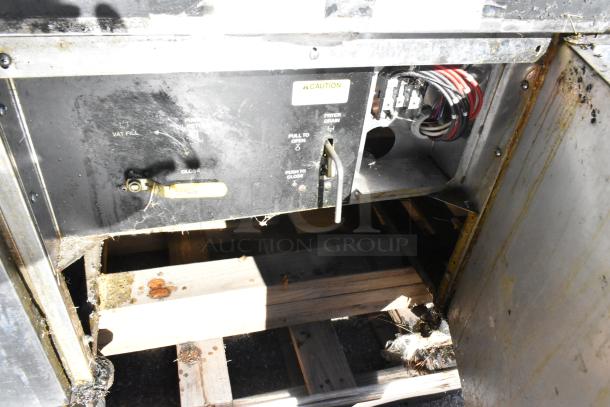 Giles EOF-24 commercial electric 3 bay deep fat fryer with dumping station. Stainless steel, 480V, 3-phase, on casters. Some visible wear.