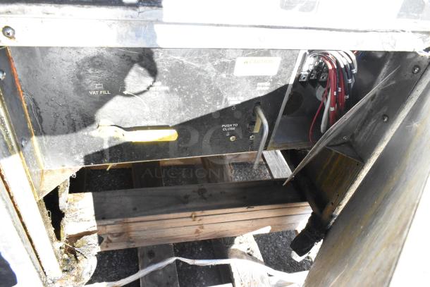 Giles EOF-24 stainless steel 3-bay deep fat fryer, electric-powered with dumping station, commercial casters, 480V, 3-phase.