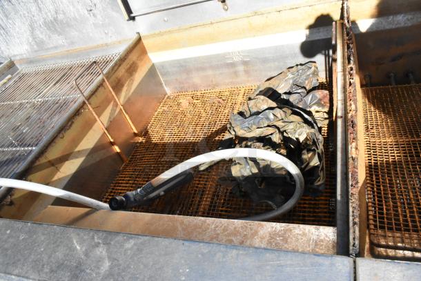 Giles EOF-24 stainless steel 3-bay deep fat fryer with dumping station, visible wear, on commercial casters, 480 volts, 3 phase.